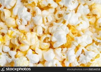 Scattered tasty cheese popcorn texture background. Fast food, movie, cinema concept. Top view, flat lay , banner, wallpaper