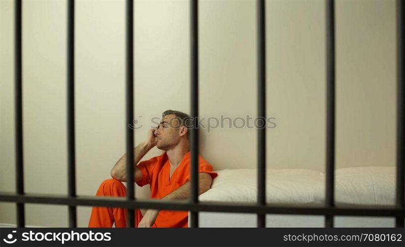 Scene of a morose inmate in prison