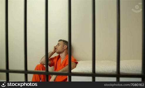 Scene of a morose inmate in prison