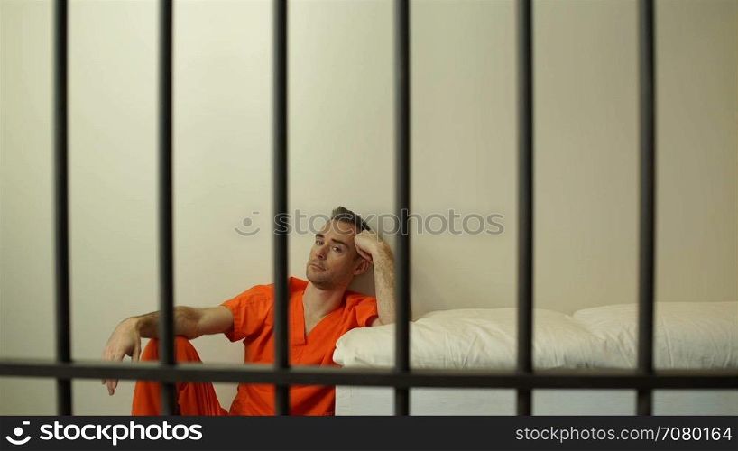 Scene of a thoughtful inmate in prison