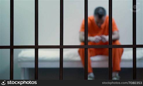 Scene of an inmate in a jail or prison
