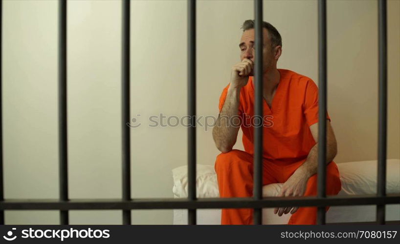 Scene of an inmate in prison weeping