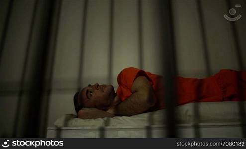 Scene of an inmate thinking about life outside prison