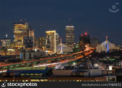 Scene of Boston skyline which can see Zakim Bridge and Tobin Bridge with express way over the Boston Cityscape at twilight time, USA downtown skyline, Architecture and building with tourist concept