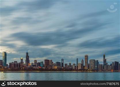 Scene of Chicago Cityscape river side along Lake Michigan at beautiful twilight time, Illinois, United States, Business Architecture and building with tourist concept