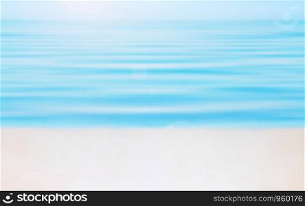 Scene of empty sunny beach along aquamarine waves - vacation concept. Abstract motion blurred seascape background with space for copy and design.