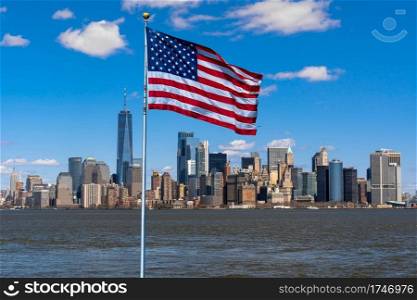 Scene of Flag of America over New york cityscape river side which location is lower manhattan,Architecture and building with tourist and Independence day concept