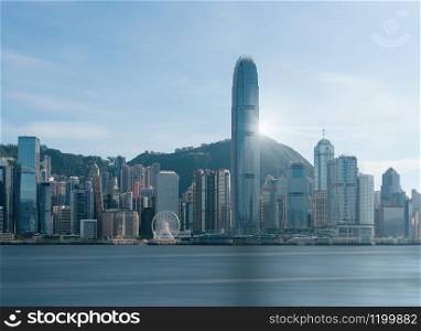 Scene of Hong Kong Cityscape river side in the afternoon with smooth cloud at Victoria harbour, presented the modern construction concept