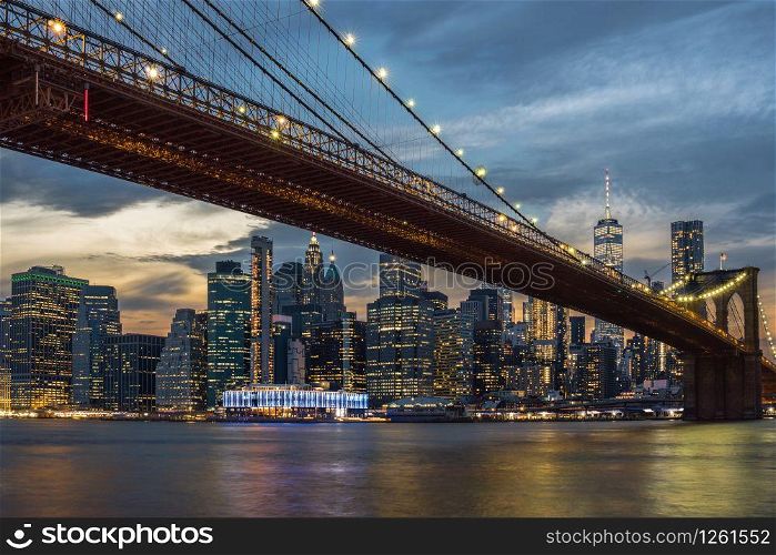 Scene of New York City Skyline And Brooklyn Bridge over the easgt river, manhattan, USA downtown skyline, Architecture and building with tourist concept