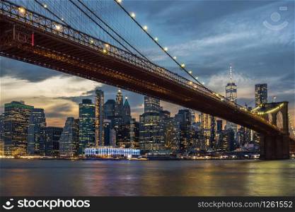 Scene of New York City Skyline And Brooklyn Bridge over the easgt river, manhattan, USA downtown skyline, Architecture and building with tourist concept