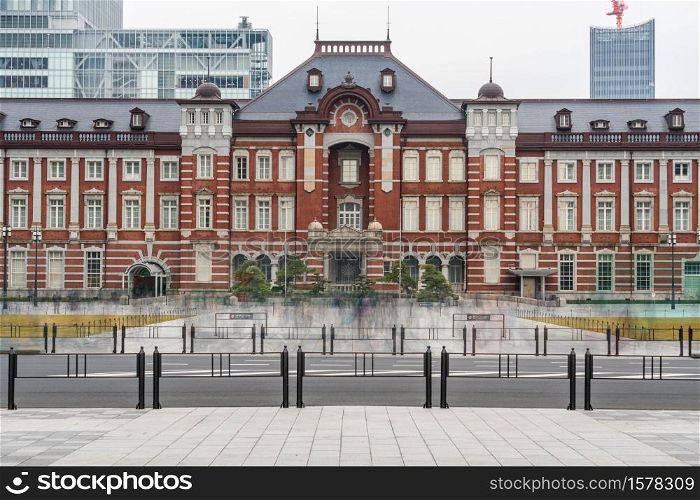 Scene of people crowd visiting and enjoying at Tokyo Station and Marunouchi with car traffic Tokyo city, Japan. building architecture and landmark concept