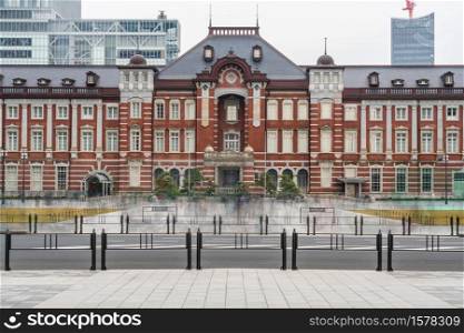 Scene of people crowd visiting and enjoying at Tokyo Station and Marunouchi with car traffic Tokyo city, Japan. building architecture and landmark concept