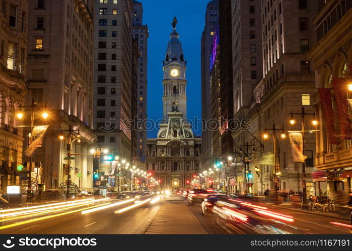 Scene of Philadelphia?s landmark historic City Hall building at twilight time with car traffic light, United States of America or USA, history and culture for travel concept