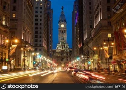 Scene of Philadelphia?s landmark historic City Hall building at twilight time with car traffic light, United States of America or USA, history and culture for travel concept