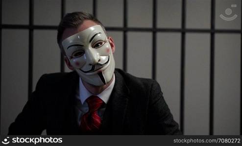 Scene of suited Anonymous hacker in prison