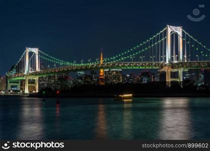 Scene of Tokyo Rainbow bridge which can see tokyo tower at the twilight time, Odaiba, Japan