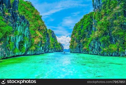 Scenery with tropical rock islands and crystal clear water