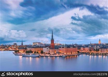 Scenic aerial panoramic view of Riddarholmen, Gamla Stan, in the Old Town in Stockholm at night, capital of Sweden. Gamla Stan in Stockholm, Sweden