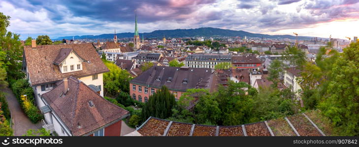 Scenic aerial panoramic view of the city at sunset. Zurich. Switzerland.. Zurich. Panoramic aerial view of the city at sunset.