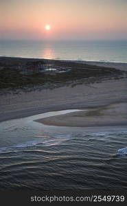 Scenic aerial view of Baldhead Island, North Carolina beach at dusk.