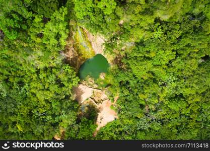 Scenic aerial view of El Limon waterfall in jungles of Samana peninsula in Dominican Republic. Amazing summer look of cascade in tropical forest from above.