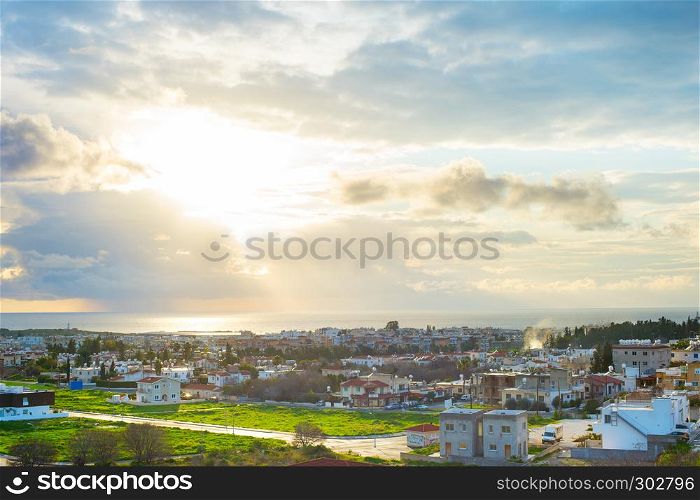 Scenic aerial view of Paphos cityscape in evening sunlight, Cyprus