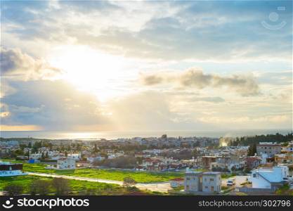 Scenic aerial view of Paphos cityscape in evening sunlight, Cyprus