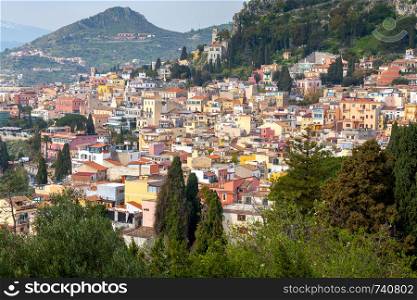 Scenic aerial view of the city on a sunny day. Taormina. Sicily. Italy.. Taormina. Sicily. Aerial view of the city on a sunny day.