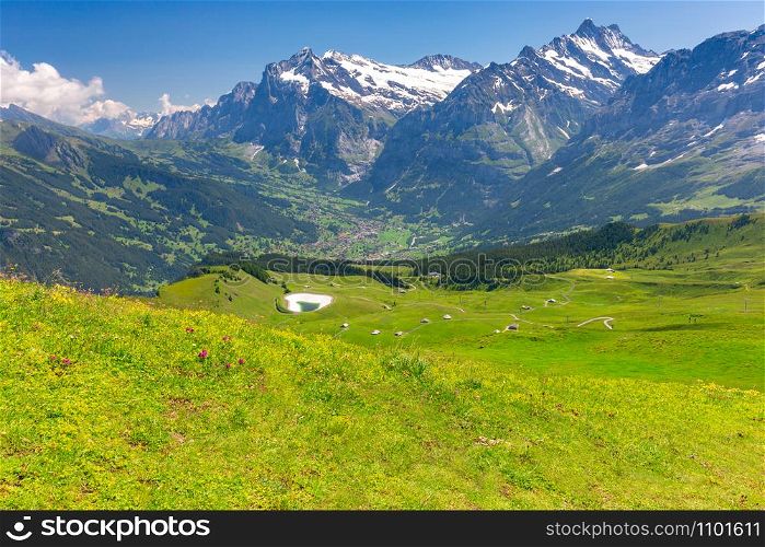 Scenic aerial view of the Swiss Alps on a sunny day. Mannlichen. View of the Swiss Alps near the city of Lauterbrunnen. Switzerland.