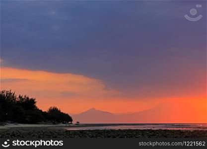 Scenic beach at sunset on a tropical island of Indonesia