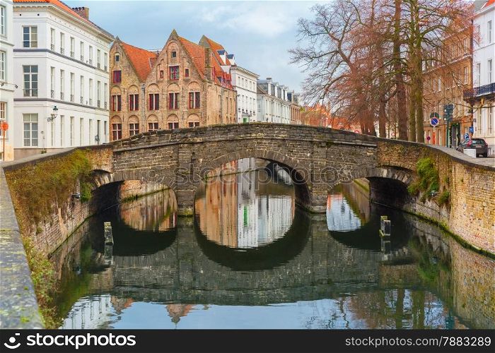 Scenic city view of Bruges canal and bridge, Belgium