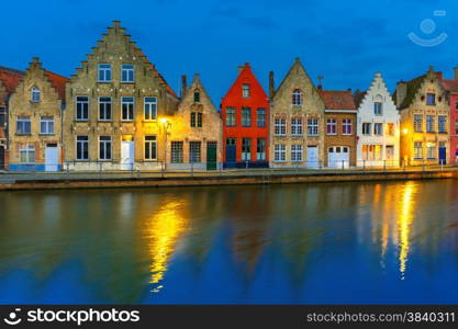 Scenic city view of Bruges canal with beautiful medieval colored houses and reflections, Belgium