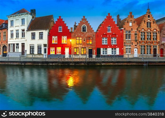 Scenic city view of Bruges canal with beautiful medieval colored houses and reflections, Belgium