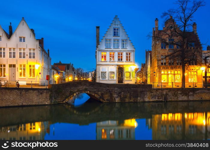 Scenic city view of Bruges canal with beautiful medieval colored houses and reflections, Belgium