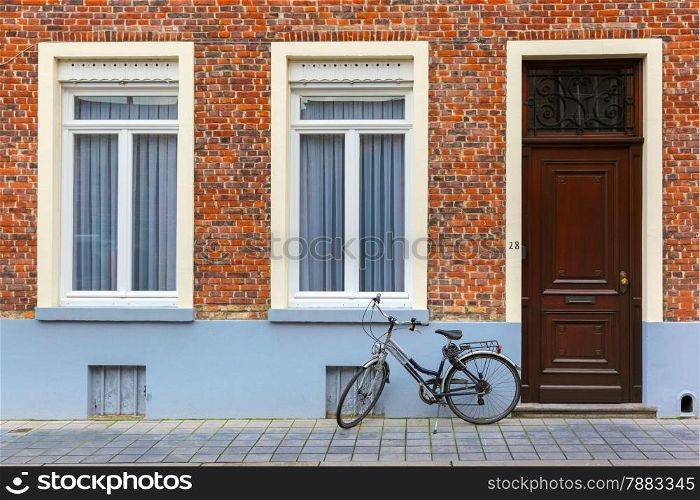 Scenic city view of Bruges street with bike, Belgium