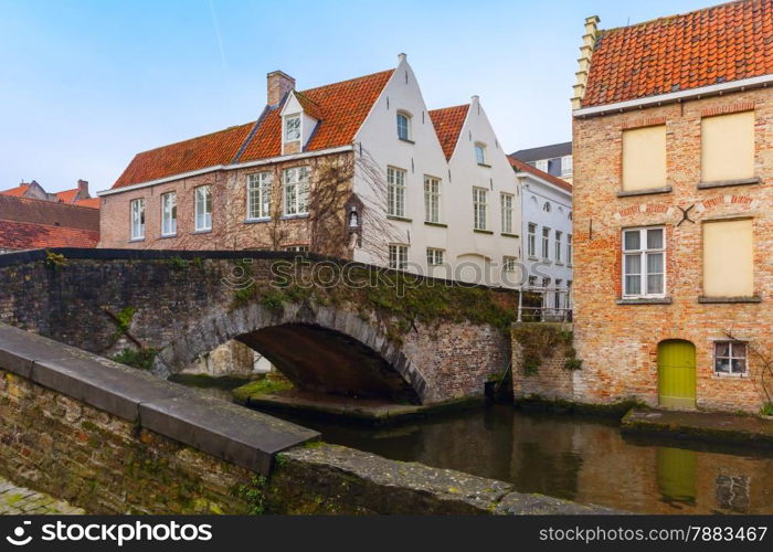 Scenic cityscape of the Green canal, Groenerei, and bridge in Bruges, Belgium