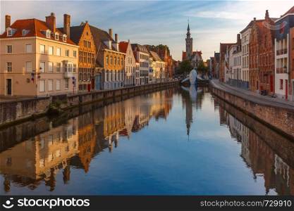 Scenic cityscape with a medieval fairytale Old town and Spiegelrei canal at sunset in Bruges, Belgium. Old town at sunset, Bruges, Belgium