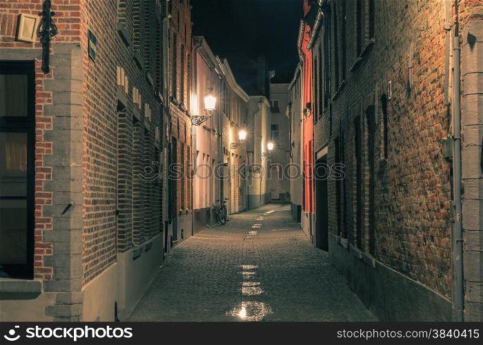 Scenic cityscape with a medieval fairytale town at night in Bruges, Belgium