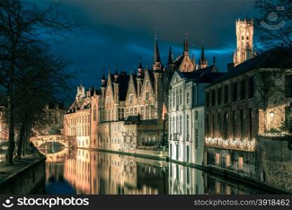 Scenic cityscape with a medieval tower Belfort and the Green canal, Groenerei, at sunset in Bruges, Belgium. Toning in cool tones