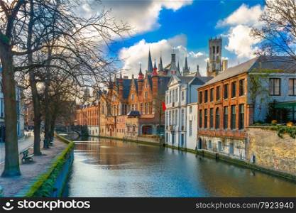 Scenic cityscape with a medieval tower Belfort and the Green canal, Groenerei, in Bruges, Belgium