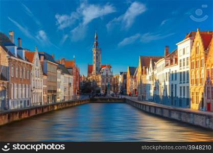 Scenic cityscape with canal Spiegelrei and Jan Van Eyck Square in the morning in Bruges, Belgium