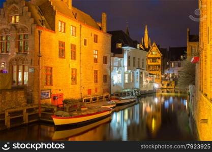 Scenic cityscape with the picturesque night medieval canal Dijver in Bruges, Belgium