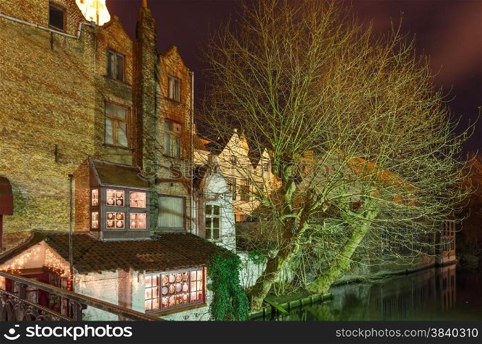 Scenic cityscape with the picturesque night medieval canal in Bruges, Belgium