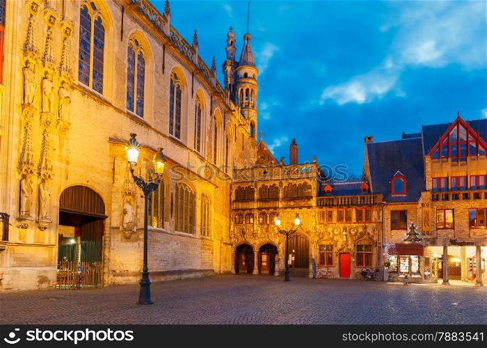 Scenic cityscape with the picturesque night medieval Christmas Burg Square in Bruges, Belgium