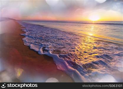 Scenic colorful sunset at the sea coast. Good for wallpaper or background image.