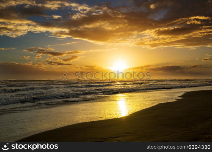 Scenic colorful sunset at the sea coast. Good for wallpaper or background image.