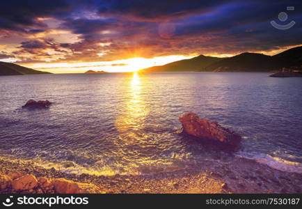 Scenic colorful sunset at the sea coast. Good for wallpaper or background image.