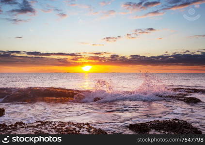 Scenic colorful sunset at the sea coast. Good for wallpaper or background image.