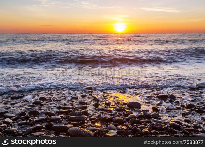 Scenic colorful sunset at the sea coast. Good for wallpaper or background image. Beautiful nature landscapes