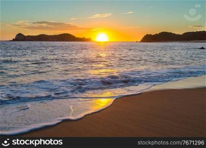 Scenic colorful sunset at the sea coast. Good for wallpaper or background image. Beautiful nature landscapes